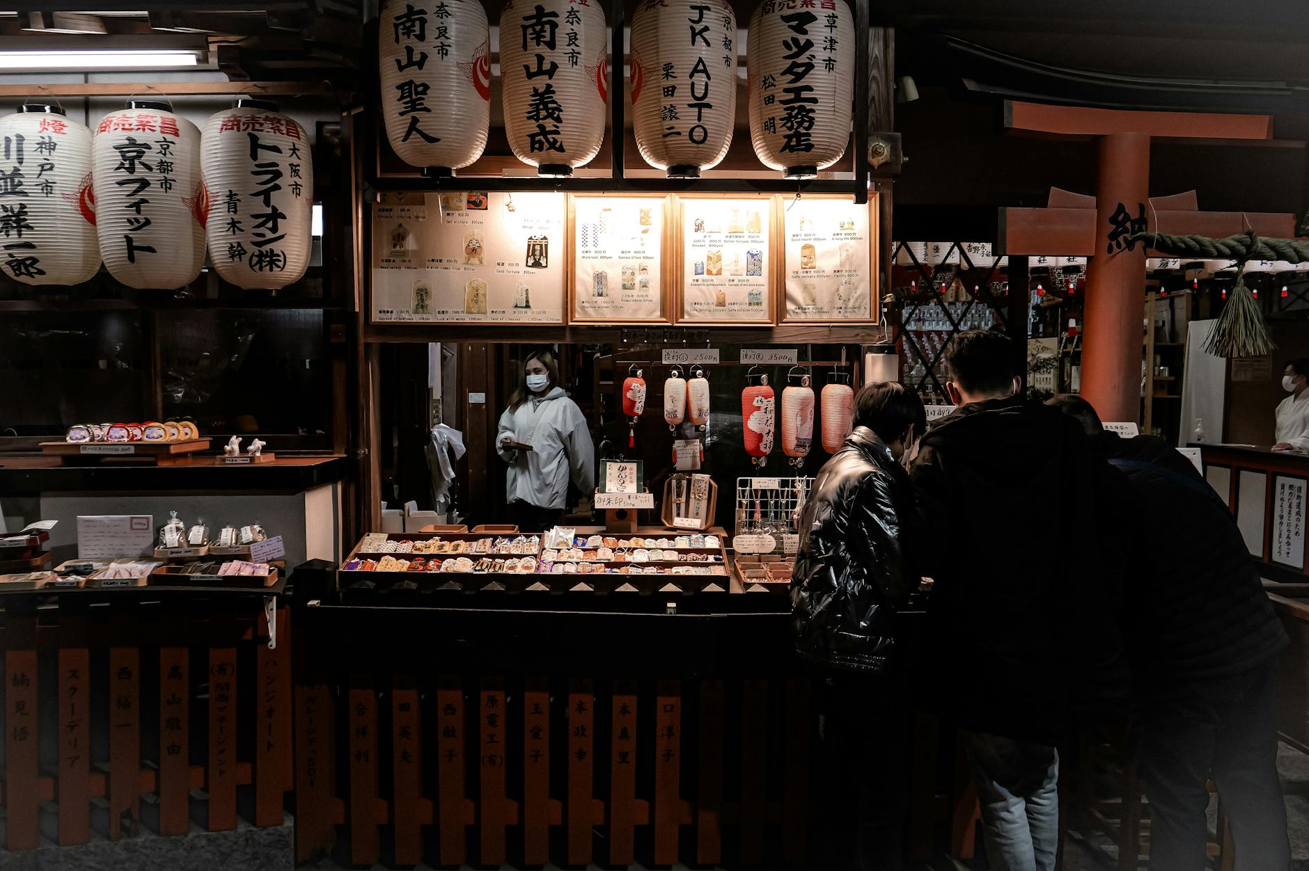 Explore the vibrant street food scene at a traditional Kyoto night market with paper lanterns and bustling stalls.