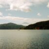 Beautiful view of Lake Ashi with Mount Fuji and red torii gate in Hakone, Japan.