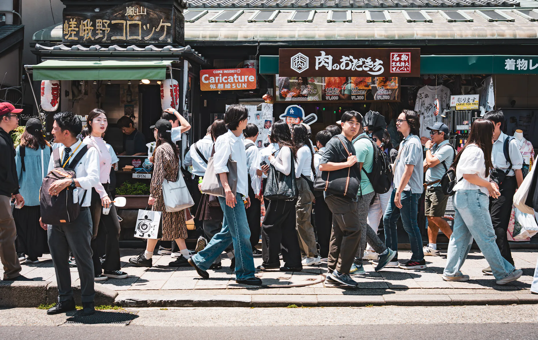 Crowded street in Kyoto showcasing vibrant daily life and culture.