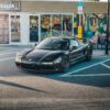 A sleek black Honda NSX parked in front of colorful street art in Tampa, Florida. — Photo by Bradikan Cars on Pexels