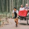 Experience a serene rickshaw journey through the iconic bamboo groves of Kyoto, Japan.
