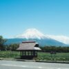 A stunning view of Mount Fuji with a traditional bus stop in Fujinomiya, Japan.