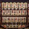 Rows of intricately decorated Japanese paper lanterns at Nishiki Tenmangu Shrine, capturing cultural heritage.