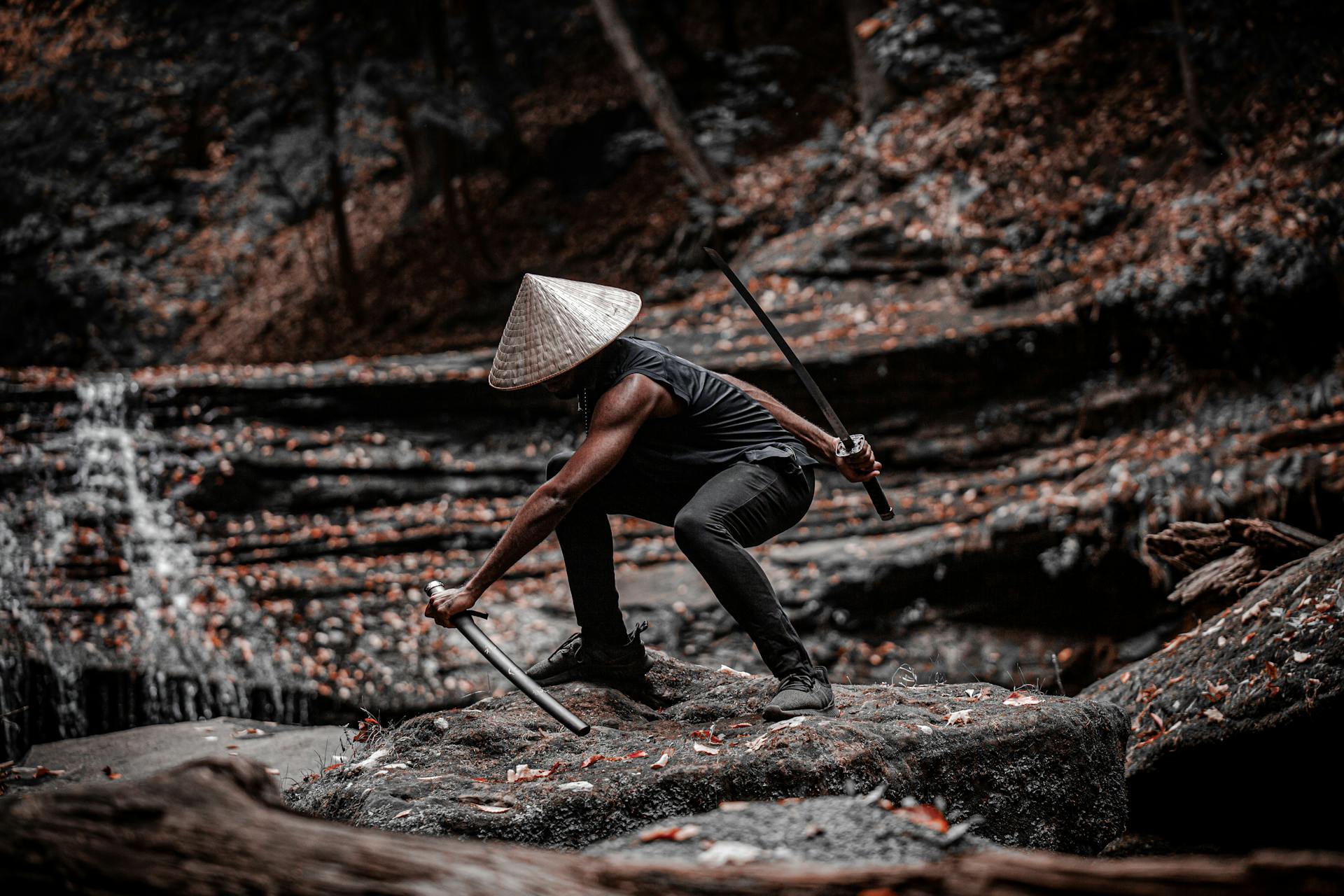 Samurai warrior crouching with sword in serene Japanese forest landscape