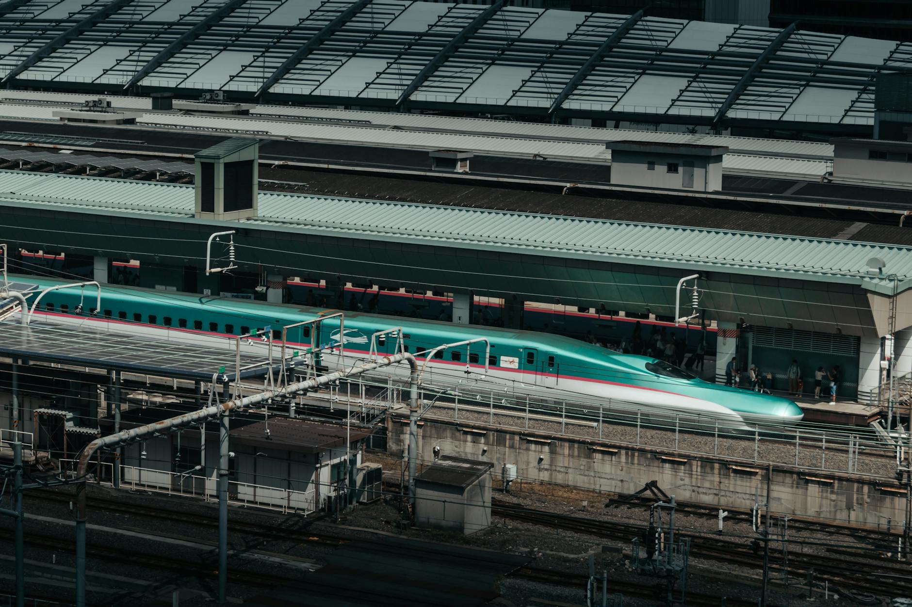High-speed Shinkansen bullet train at Tokyo Station in Japan, showcasing modern transport.