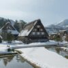 Snow-covered traditional Gassho-Zukuri houses in Shirakawa-go, Japan during winter.