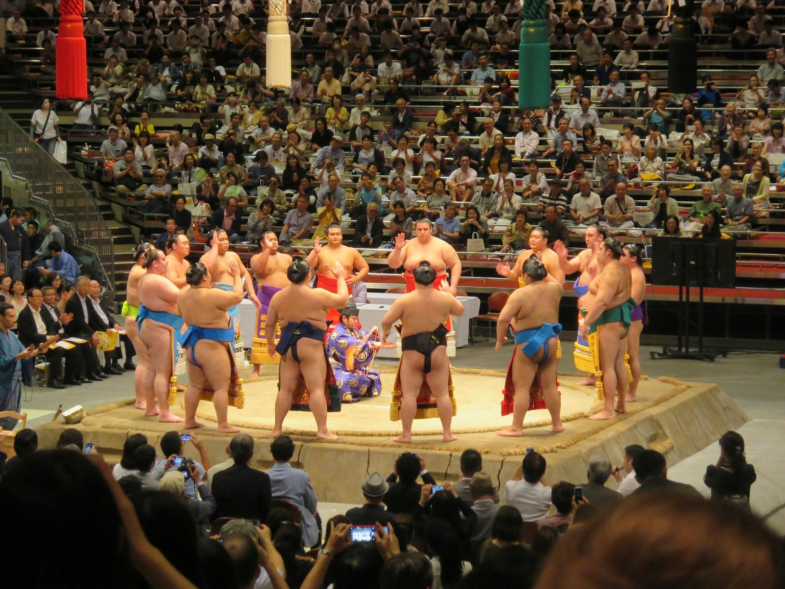 Sumo wrestlers gathered in a Tokyo arena during a traditional tournament