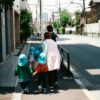 A group of children with a teacher walking in a Tokyo street, Japan.