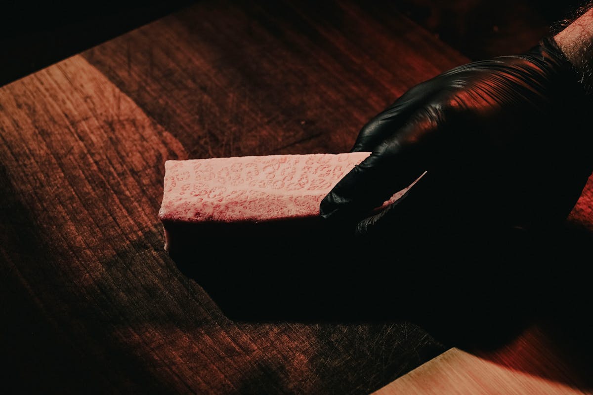 Chef handling premium wagyu beef in Tokyo restaurant