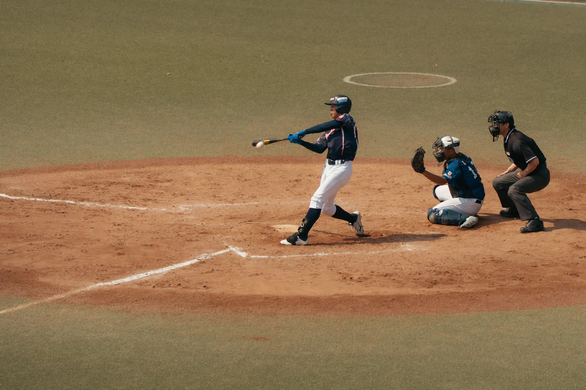 Action shot of a baseball player batting in Tokyo, Japan.