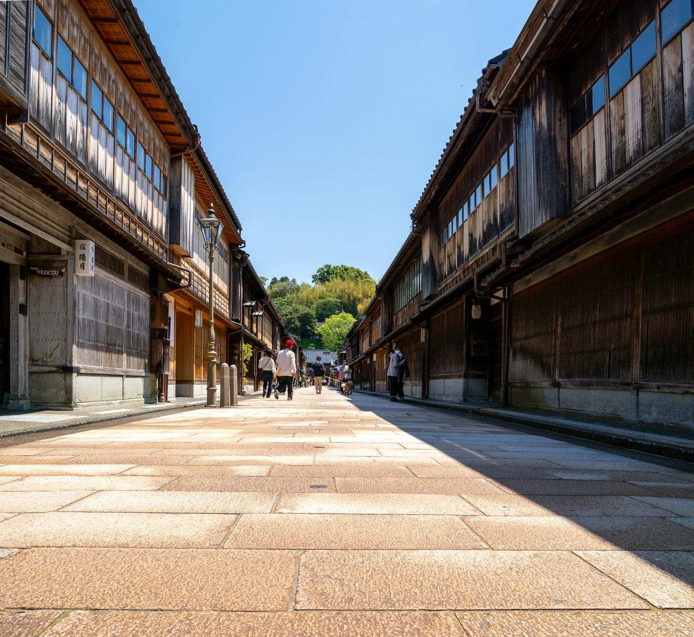 Stroll down the historic streets of Higashi Chaya in Kanazawa, showcasing traditional wooden architecture.